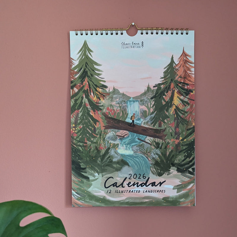 Wall calendar with nature design on a pink wall